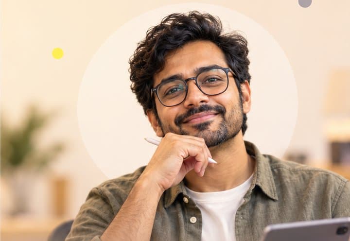 Business analyst with glasses, hand on chin, in a bright office